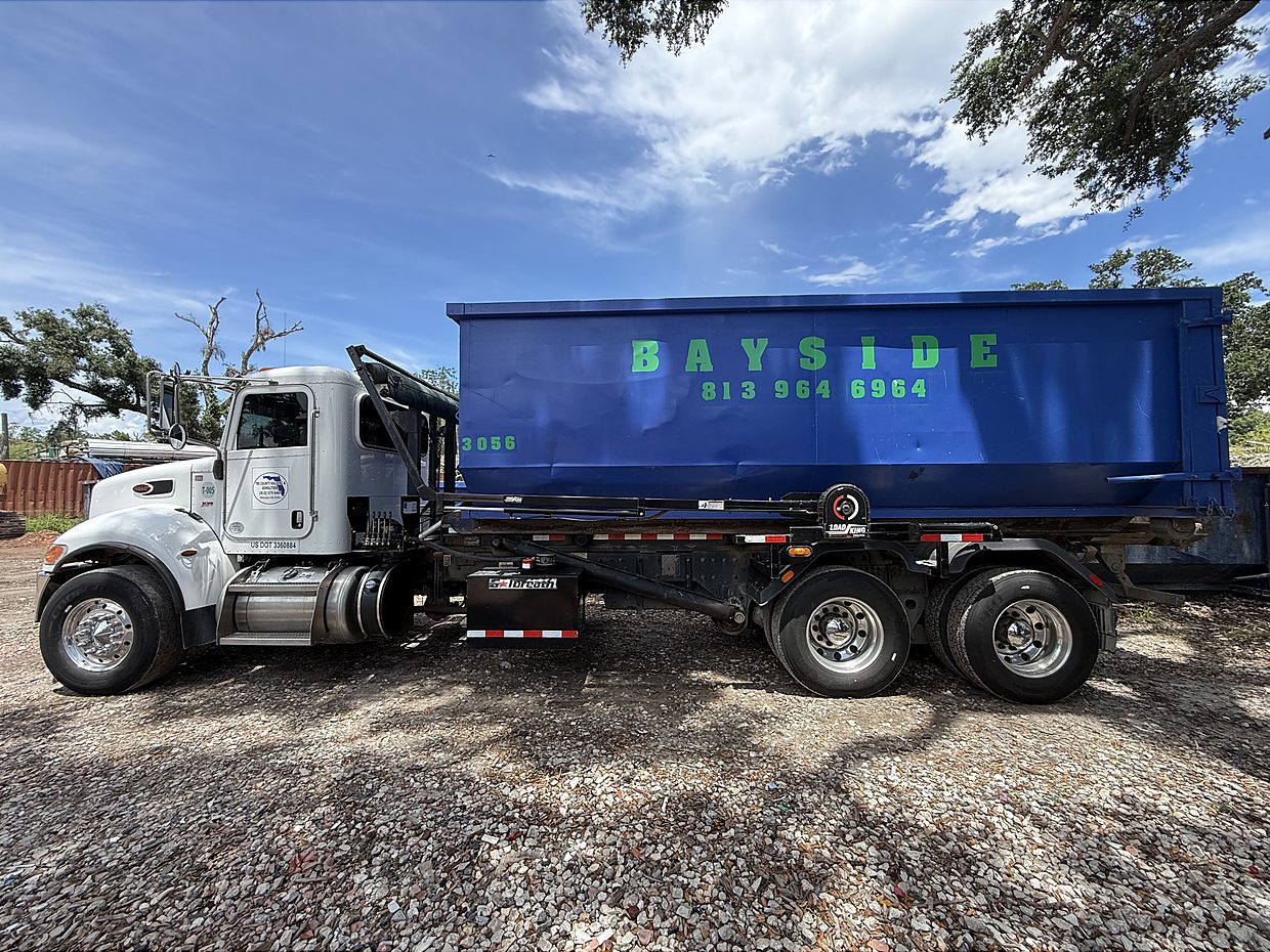 Roll-off trucks ready for dumpster delivery in Tampa Bay