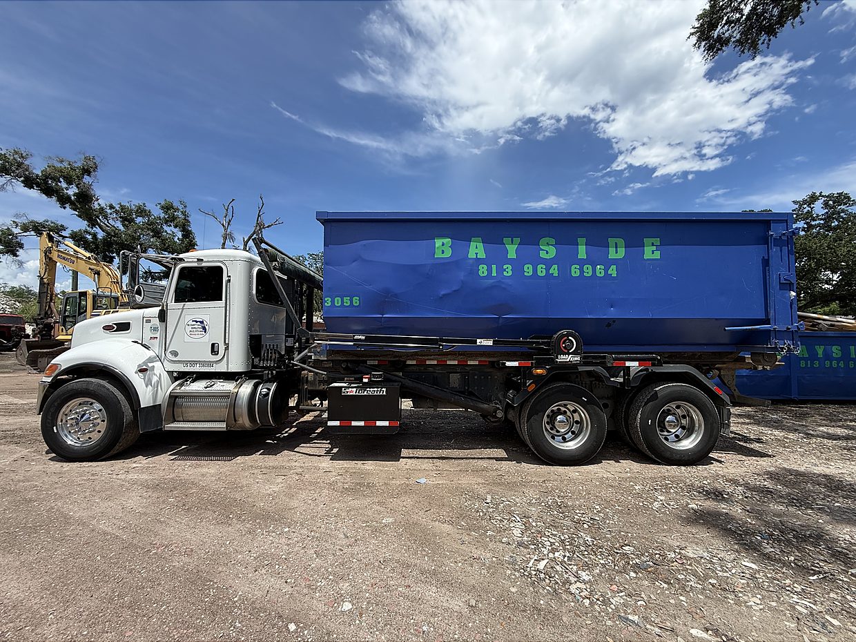 Global Recycling roll-off truck fleet at the yard